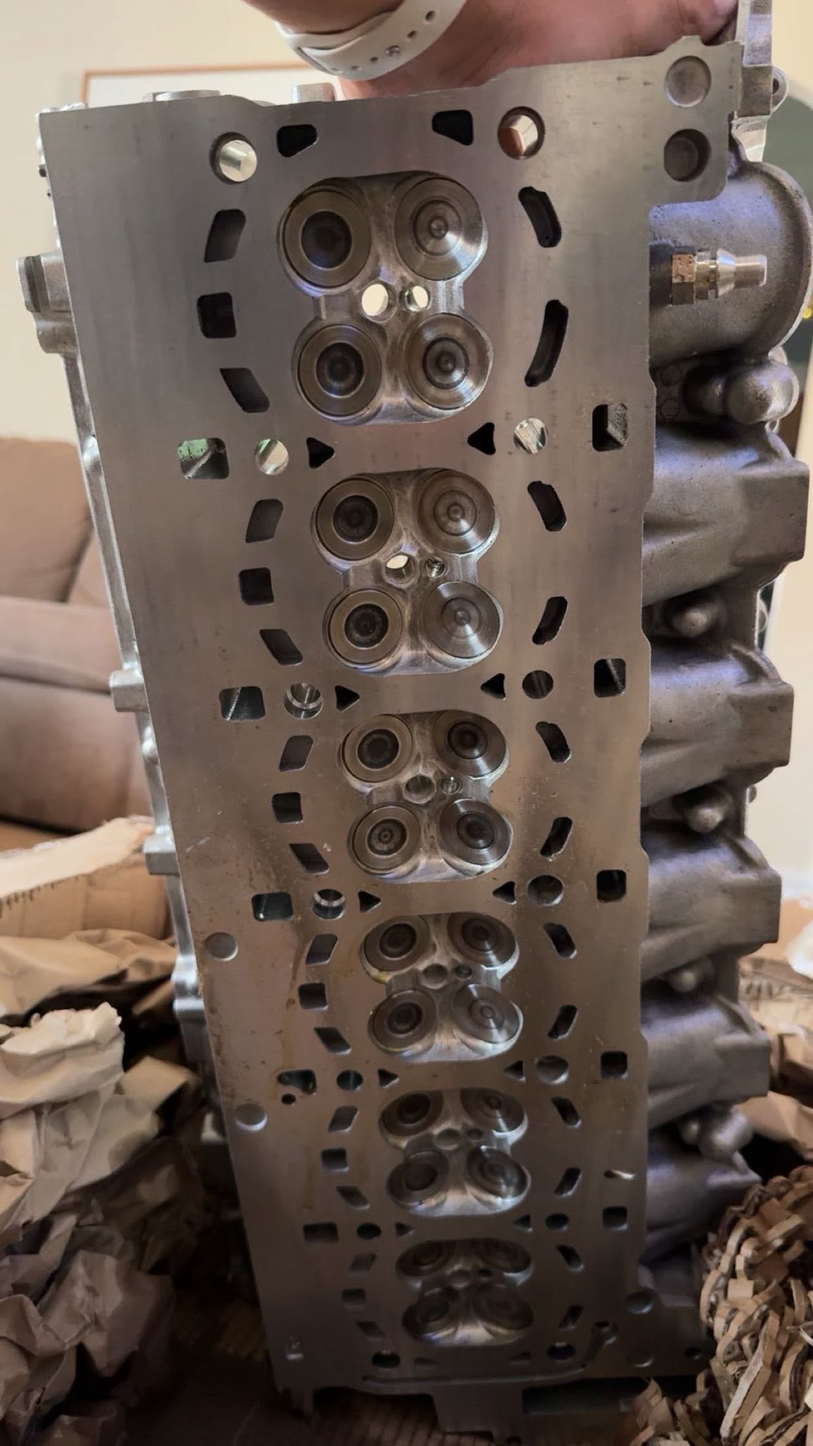 Close view of the machined face of a metal cylinder head