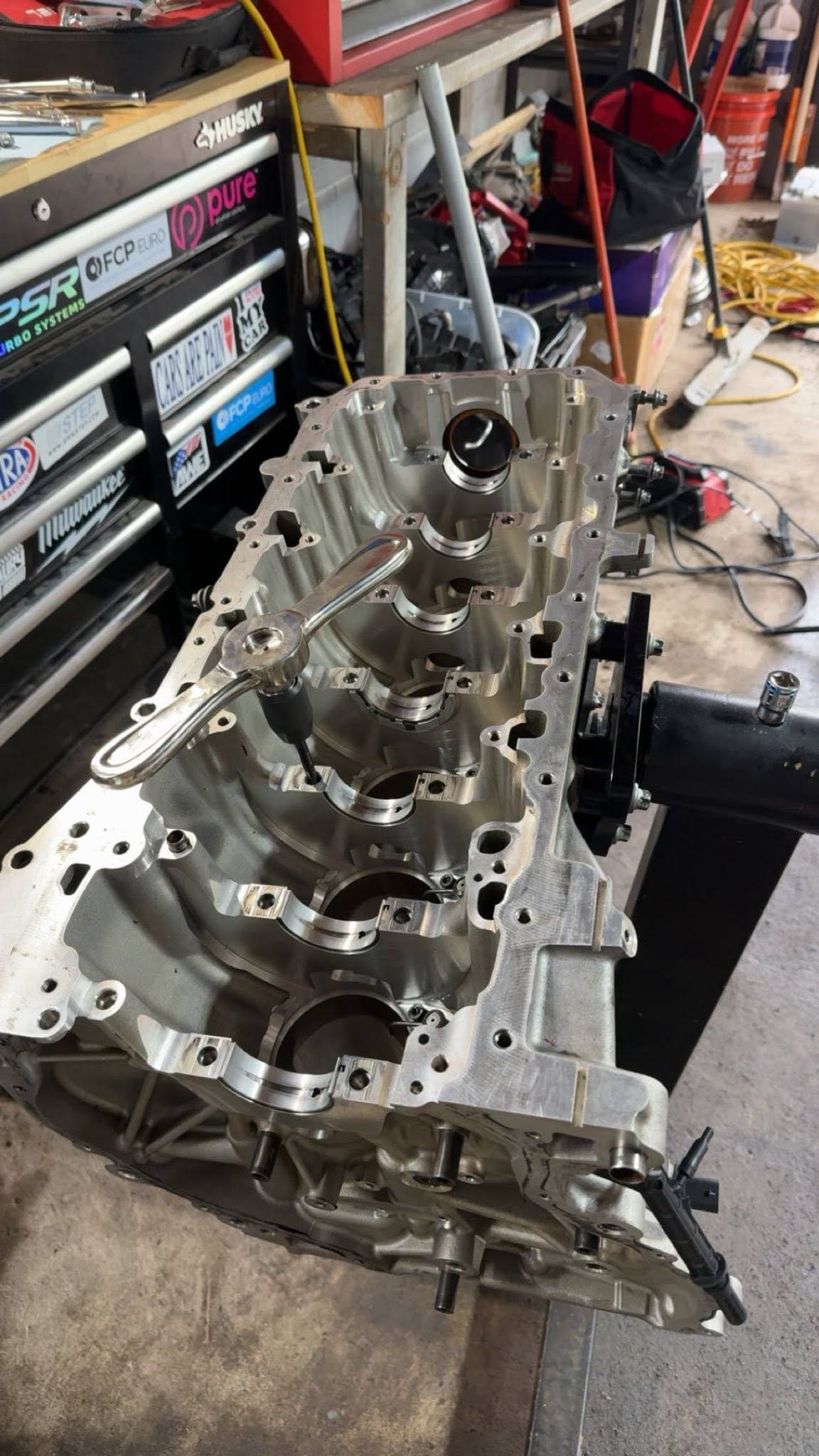 Close view into an open engine block mounted on a stand